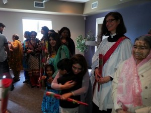 kids presenting flowers to mothers